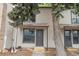Inviting townhome with neutral siding and ample natural light streaming through large windows at 3550 S Harlan St # 105, Denver, CO 80235