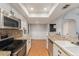 Bright kitchen featuring stainless steel appliances, granite countertops, and lots of cabinets at 3550 S Harlan St # 105, Denver, CO 80235