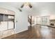 Open concept living space showcasing flooring, fireplace, and laundry area at 3550 S Harlan St # 105, Denver, CO 80235