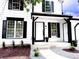 Charming home entrance with manicured landscaping and a bright white front door at 19545 E Bates Ave, Aurora, CO 80013