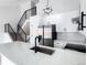 Spacious modern kitchen with white cabinets, stainless steel appliances, and sleek black hardware at 19545 E Bates Ave, Aurora, CO 80013