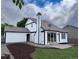 Backyard view of a two-story home with modern paint and updated landscaping at 19545 E Bates Ave, Aurora, CO 80013