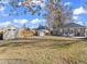 Expansive backyard showcasing a shed, seating area, lush lawn, offering plenty of outdoor space at 1221 Ulster St, Denver, CO 80220