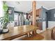 Bright dining area with a wooden table and a view of the updated kitchen and stainless appliances at 1221 Ulster St, Denver, CO 80220