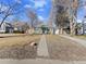 Charming single-story home with a well-manicured lawn and inviting curb appeal at 1221 Ulster St, Denver, CO 80220