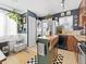 Eat-in kitchen with green island, stainless steel refrigerator, and washer/dryer hookups at 1221 Ulster St, Denver, CO 80220