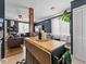 Open concept kitchen with island, mosaic tile, and easy flow to dining and living area at 1221 Ulster St, Denver, CO 80220