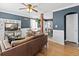 Stylish living room featuring dark blue walls, hardwood floors, and modern decor at 1221 Ulster St, Denver, CO 80220