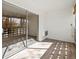 Enclosed balcony with tile flooring and slider door access to living room at 9385 E Center Ave # 1B, Denver, CO 80247