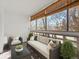 Enclosed balcony with comfortable seating, offering a cozy outdoor living space at 9385 E Center Ave # 1B, Denver, CO 80247