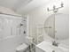 Bright bathroom with modern lighting, white vanity and shower/tub at 9385 E Center Ave # 1B, Denver, CO 80247