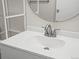 Modern white vanity with chrome faucet in a well lit bathroom setting at 9385 E Center Ave # 1B, Denver, CO 80247