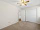 Large bedroom features neutral carpet and closet storage at 9385 E Center Ave # 1B, Denver, CO 80247