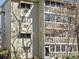 Close-up of an apartment building showcasing brickwork, windows, and exterior design at 9385 E Center Ave # 1B, Denver, CO 80247