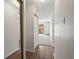 Hallway with wood flooring, closet and carpet leading to a balcony in a light-filled apartment at 9385 E Center Ave # 1B, Denver, CO 80247
