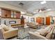 View of lobby with modern fireplace, seating, and doorways labeled 'East' and 'West' at 9385 E Center Ave # 1B, Denver, CO 80247