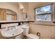Bathroom with white tile and fixtures at 1259 S Elizabeth St, Denver, CO 80210