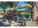 Several brightly colored covered quadricycles are parked next to each other at 1259 S Elizabeth St, Denver, CO 80210