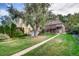 The home is situated on a well-manicured lot with mature trees, offering shade and privacy at 1259 S Elizabeth St, Denver, CO 80210