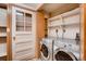 Convenient laundry room featuring modern appliances and ample storage space at 1259 S Elizabeth St, Denver, CO 80210