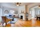 Bright living room with hardwood floors, fireplace and comfortable seating at 1259 S Elizabeth St, Denver, CO 80210