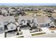 Stunning aerial view of a meticulously landscaped home with well-manicured lawns and inviting curb appeal in a desirable neighborhood at 6851 Copper Sky Cir, Castle Pines, CO 80108