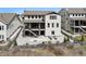 Backyard view of multi-level deck, patio seating area, and fenced yard creating a private outdoor space at 6851 Copper Sky Cir, Castle Pines, CO 80108