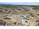 Aerial view of a modern community with a pool, clubhouse, playground, and green spaces at 6851 Copper Sky Cir, Castle Pines, CO 80108