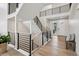 Beautiful staircase featuring a modern black railing and lots of natural light at 6851 Copper Sky Cir, Castle Pines, CO 80108
