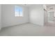 Bright bedroom with neutral carpeting, white walls, baseboards and trim and a double door closet at 16549 Black Rose Cir, Parker, CO 80134