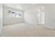 Bright bedroom with carpet, white walls, and a double window that fills the space with natural light at 16549 Black Rose Cir, Parker, CO 80134
