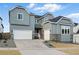 Beautiful two-story home featuring a three-car garage and well-maintained landscaping at 16549 Black Rose Cir, Parker, CO 80134