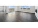 Open-concept living space with fireplace and view to outdoor patio through sliding glass doors at 16549 Black Rose Cir, Parker, CO 80134