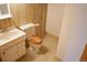 Small bathroom featuring a sink and toilet with a wood-colored seat at 5431 S Hickory St, Littleton, CO 80120