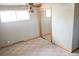Bedroom with a ceiling fan and natural light, featuring a mirrored closet at 5431 S Hickory St, Littleton, CO 80120