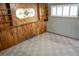 Bedroom with wood paneling and stained glass accent at 5431 S Hickory St, Littleton, CO 80120