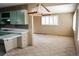 View of kitchen and dining room with neutral paint and cabinets at 5431 S Hickory St, Littleton, CO 80120