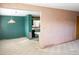 View of open-concept living room with pink walls at 5431 S Hickory St, Littleton, CO 80120