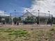A full batting cage with multiple stations and netting for practicing baseball or softball at 5431 S Hickory St, Littleton, CO 80120