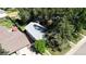 An aerial view of the property shows a landscaped yard with mature trees and a detached garage at 4430 S Cherokee St, Englewood, CO 80110