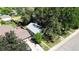 An aerial view of the property shows a landscaped yard with mature trees and a detached garage at 4430 S Cherokee St, Englewood, CO 80110