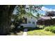 Exterior backyard view with a door and window allowing a peek into the home at 4430 S Cherokee St, Englewood, CO 80110