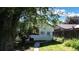 Exterior backyard view with a door and window allowing a peek into the home at 4430 S Cherokee St, Englewood, CO 80110