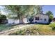 A backyard featuring a detached garage, a walking path and grassy area at 4430 S Cherokee St, Englewood, CO 80110