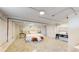 Carpeted bedroom features a white color scheme and stylish furniture and lighting at 4430 S Cherokee St, Englewood, CO 80110