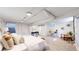Bedroom with carpet, white walls, and small writing desk and chair at 4430 S Cherokee St, Englewood, CO 80110