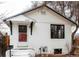 Charming single-story home featuring a white exterior, classic roofline, and inviting front entrance at 4430 S Cherokee St, Englewood, CO 80110