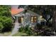 Charming single-story home with well-manicured lawn and beautiful landscaping at 4430 S Cherokee St, Englewood, CO 80110
