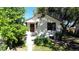 Inviting single-story home with landscaped front yard and mature trees at 4430 S Cherokee St, Englewood, CO 80110