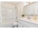 Bright bathroom featuring a shower-tub combo and a modern vanity with a decorative mirror at 2231 S Vaughn Way # 317 B, Aurora, CO 80014
